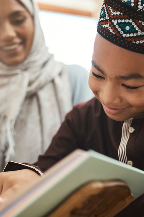 shot-of-a-young-muslim-mother-and-her-son-reading-2022-10-05-04-55-19-utc-copy.jpg